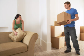 Couple Unboxing in New Place after receiving Renters Insurance in Houston, Galveston, Pearland, Webster, League City